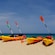 Kayaks and paddles on a beach